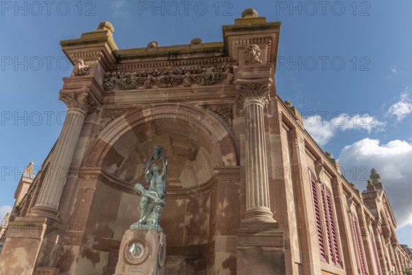 The statue of the winegrower, work of Auguste Bartholdi in front of the covered market in the city