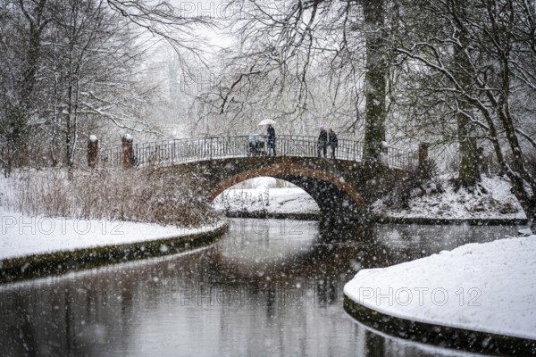 Copenhagen, Denmark, January 06, 2021: People enjoying a snowy winter day in Frederiksberg Gardens,