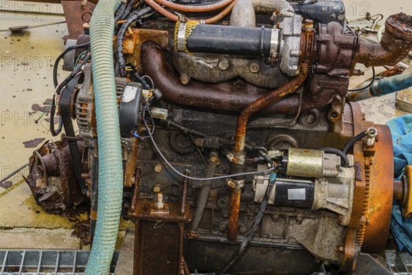 Taean, South Korea. August 14, 2019: Closeup of rusted inboard engine exposed to elements sitting