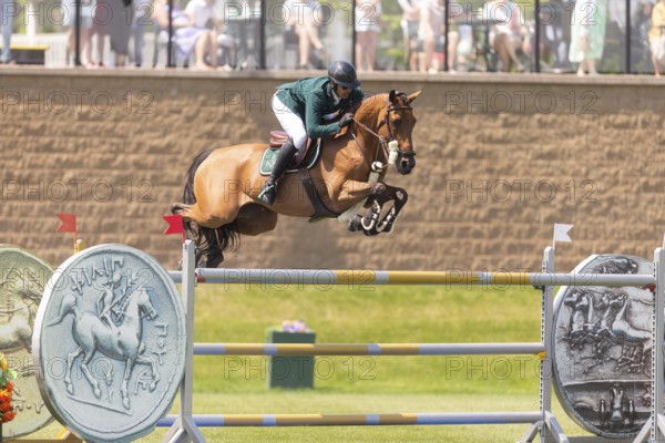 Abdulrahman Alrajhi from Saudi Arabia and riding Heartbeat W, compete in the 1.60m Grand Prix