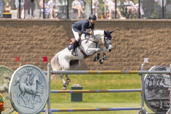 Daniel Bluman of Israel and riding Corbie V.V., compete in the 1.60m Grand Prix during The