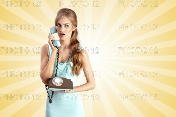 Creative photo of a pretty pin up girl talking about vintage phone on colourful abstract cartoon