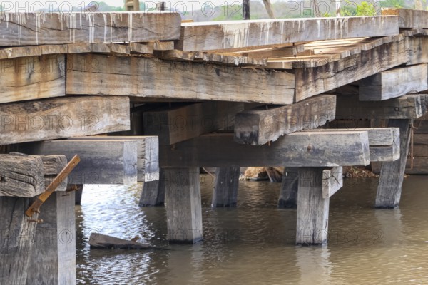 Run-down wooden bridge of the Transpantaneira crossing a river, Pantanal Wetlands, Mato Grosso,