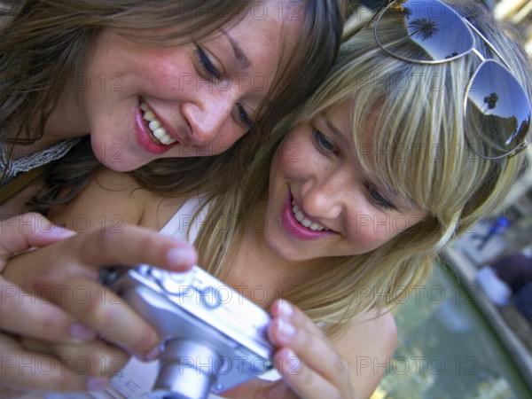 Two woman taking a selfie with the camera, Barcelona, Spain, Europe