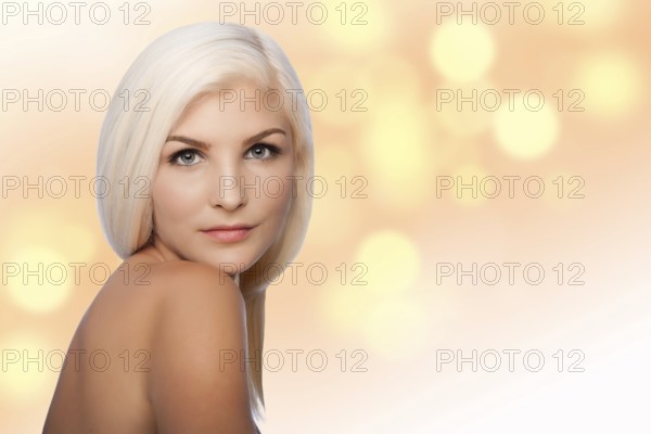 Beautiful face of young woman for Aesthetics facial skincare concept looking over shoulder, on