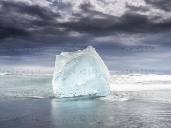 Diamond Beach, iceberg in the surf, near Jökulsarlon glacier lagoon, Vatnajökull National Park,