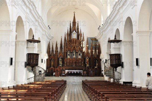 Interior of a church with Gothic altar and long pews for parishioners, Trinidad, Cuba, Central