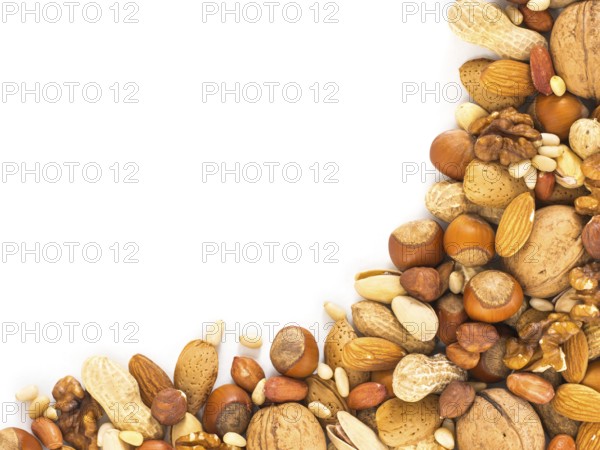 Background of mixed nuts - hazelnuts, almonds, walnuts, pistachios, peanuts, pine nuts peeled and