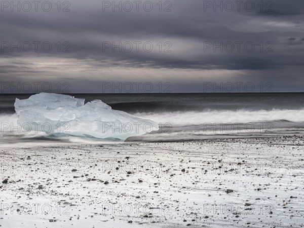 Diamond Beach, iceberg in the surf on the black lava beach, near Jökulsarlon glacier lagoon,