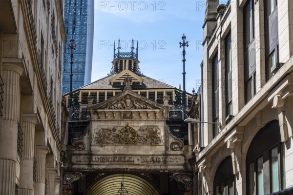 London, UK, May 14, 2019: Low angle view of the entrance to Leadenhall Market. Originally a meat,
