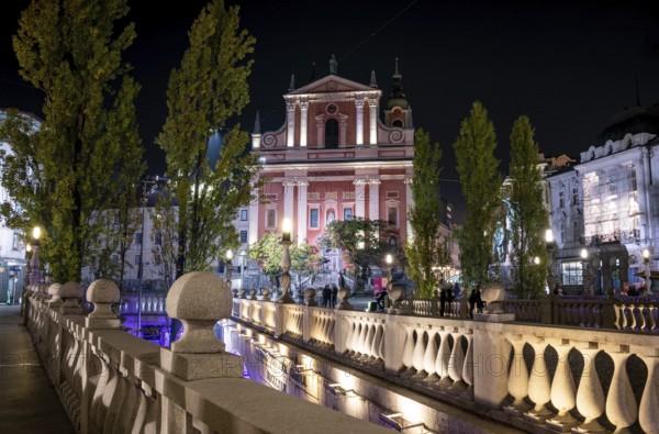 Famous Three Bridges and the Preseren square in the center of Ljubljana illuminated at night,