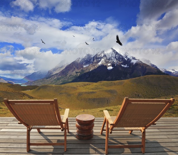 Pleasant holiday. Chile. Wooden chairs in the park Torres del Paine. On the horizon is visible