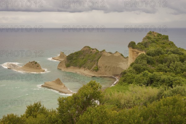 View of Cape Drastis, rock formation, limestone rock, rock, fan palm, spring, Peroulades,