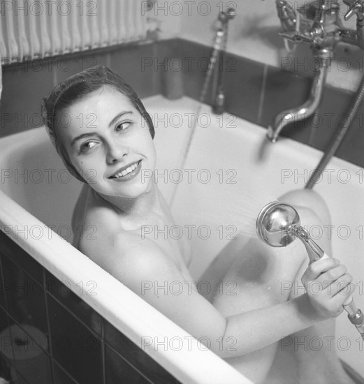 1940s woman in the bathtub. The young ballet girl Rigmor Dall is taking a morning bath. According
