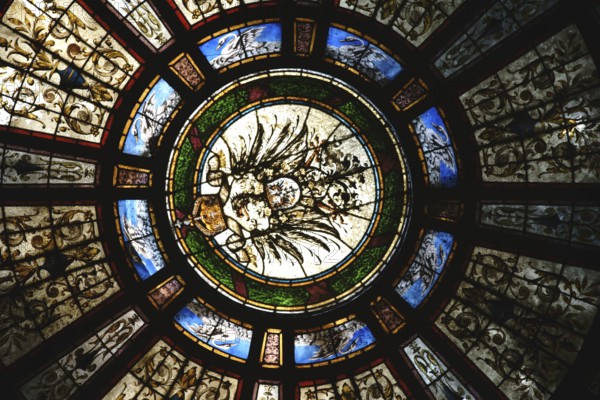 Bad Homburg, Germany - May 19, 2018: The colourful motif-painted windows of the entrance dome of