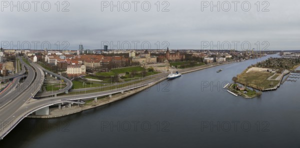 Aerial view of Chrobry Shafts, moored ships on the Oder River and castle like buildings of National