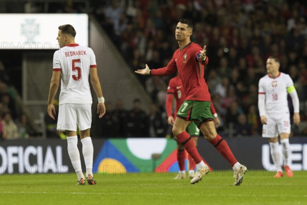 Football match, captain Cristiano RONALDO CR7 Portugal centre with both arms pointing upwards not