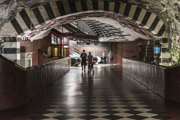 Stockholm, Sweden, 07 24 2019- Decorated interior of the underground metro with a young couple