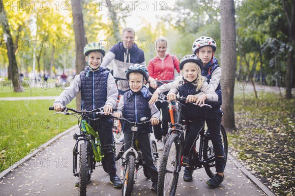 Theme family sports holiday in park in nature. big friendly Caucasian family of six people mountain