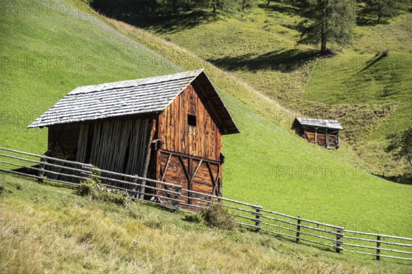An old wooden hay shed in Val di Morins, the Dolomite Alps of South Tirol