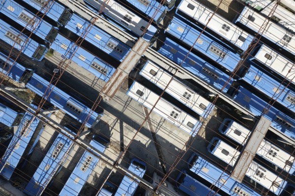 Drone aerial top view.photo of abandoned transport Blue buses parking. shabby and broken vehicle.