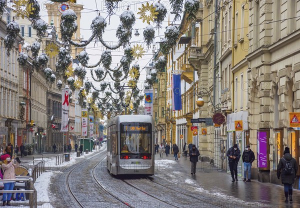Graz, Austria - December 03, 2020: Beautiful Christmas decorations on famous Herrengasse street in