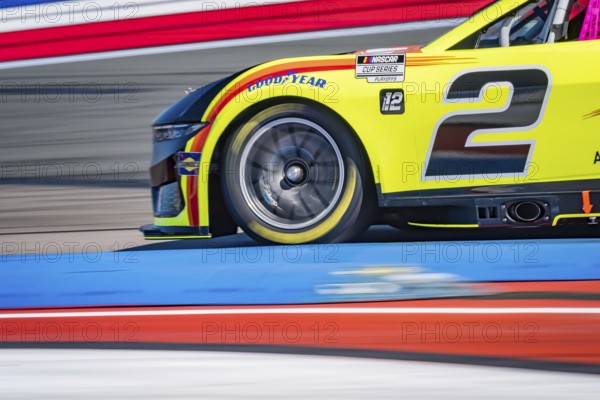 NASCAR Cup Series driver, AUSTIN CINDRIC (2), races through the turns during a practice session for