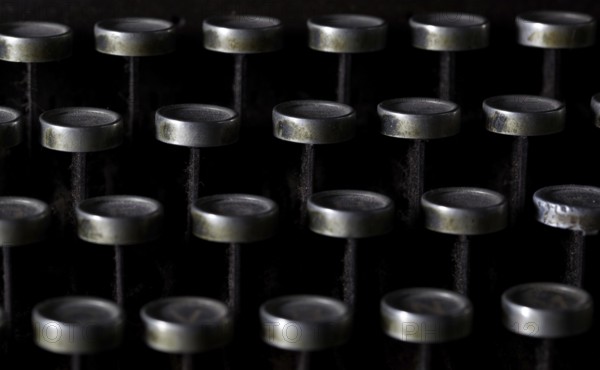 Keyboard of a vintage typewriter in close up, frontal view