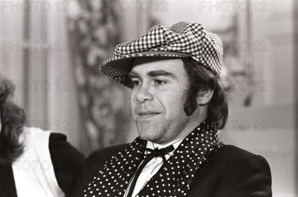 Elton John. English singer, songwriter born march 25 1947. Pictured wearing a chequered cap and a