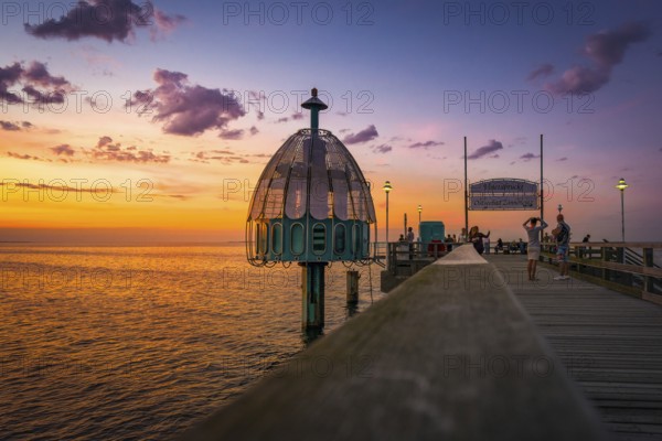 The Zinnowitz pier with diving bell in summer shortly after sunset