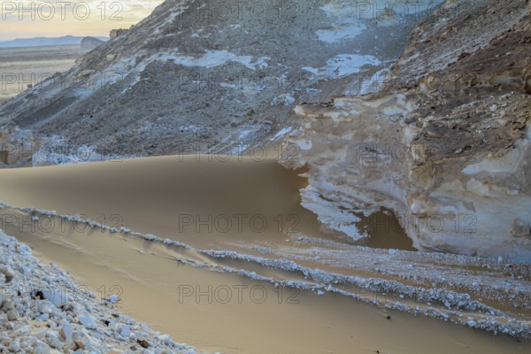 Late afternoon sun casting shadows on rocks in the Libyan desert white desert, Farafra, Egypt,