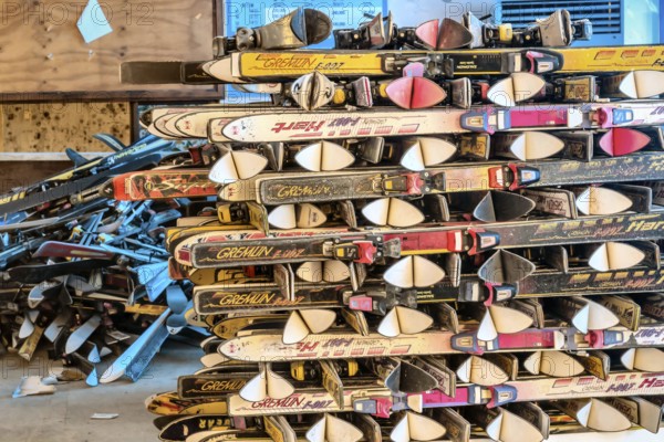 Goesan, South Korea. May 29, 2020: Snow skis from various manufactures stacked in rows in sunlit