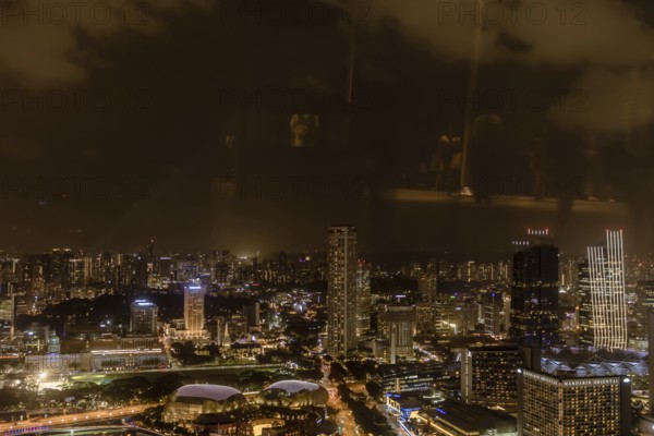 Singapore City, Singapore, January 23, 2019: Beautiful aerial night view of Marina Bay and the