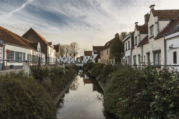 Lissewege, Flanders, Belgium, 10 30 2018: View over the old paved streets, houses and a creek