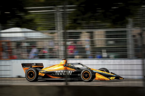 PATO OWARD (5) of Monterey, Mexico runs through the streets during the Honda Indy Toronto in