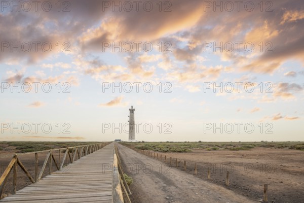 Dusk, landscape shot with lighthouse in nature reserve. View of the sea at sunset. Lighthouse