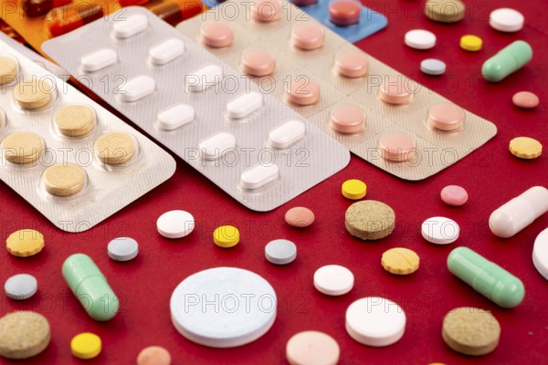 Different colorful pills and capsules in packs - blisters. Global pharmaceutical industry for