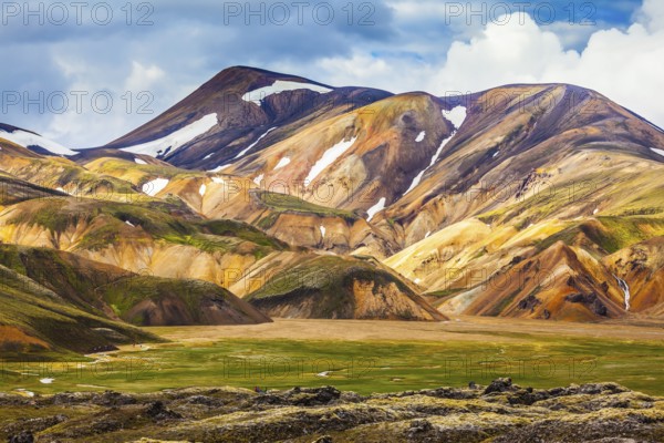 National Park Landmannalaugar. On the gentle slopes of the mountains are snow fields and glaciers.