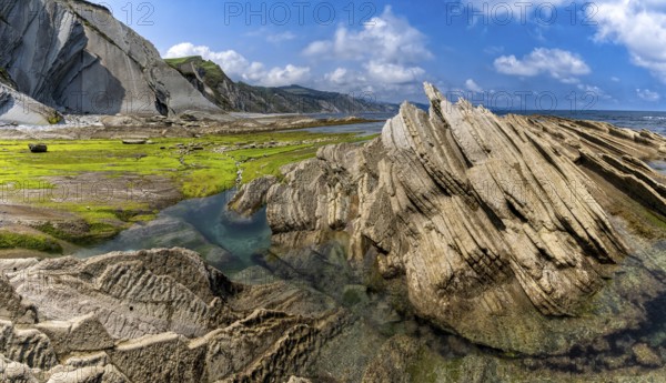 A view of the Flysch rock formations and cliffs with tidal pools on the Basque Country coast near