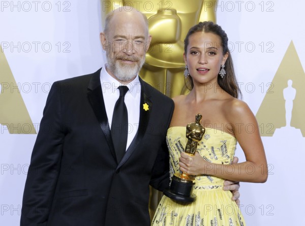 Alicia Vikander and J.K. Simmons at the 88th Annual Academy Awards, Press Room held at the Loews