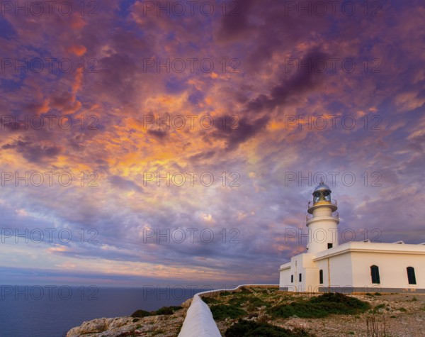 Menorca sunset in Faro Far de Caballeria Lighthouse at Balearic Islands es Mercadal