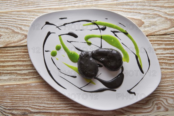 Molecular gastonomy cuttlefish roes with citrus mayonnaise