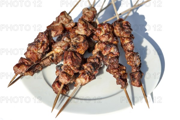 Lamb kebab shashlik from the grill on a wooden skewer
