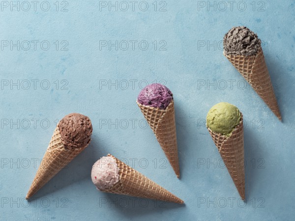 Various ice cream scoops in cones with copy space. Colorful ice cream in cones chocolate,