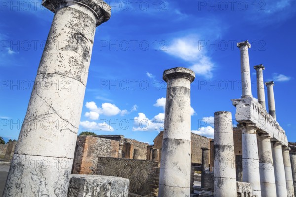 Pompeii in Italy, ruins of the antique Temple of Apollo with bronze Apollo statue, Naples