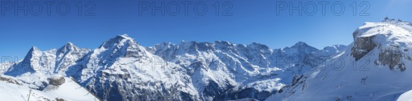 Various alpine peaks including Eiger, Moench, and Jungfrau, seen from the skiing resort Schilthorn