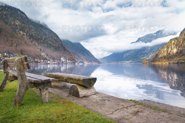 Travel destinations theme image with the Dachstein Mountains reflected in the water of the