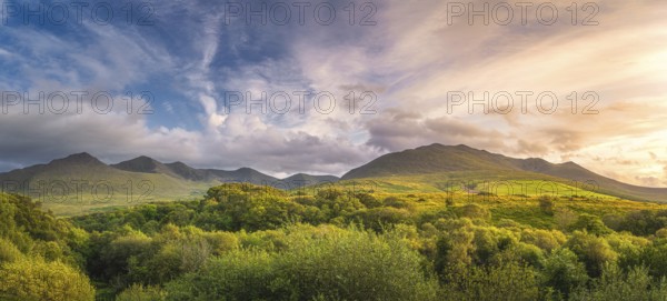Large panorama with amazing sunset and dramatic sky at the foothill of Carrauntoohil mountain,