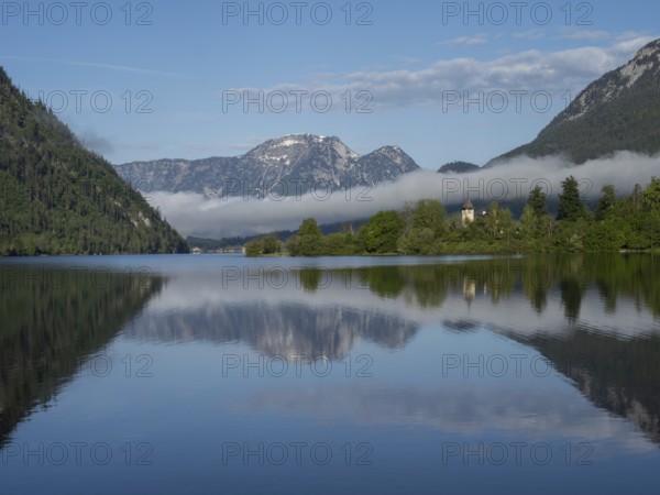 Morning atmosphere, reflection, early morning fog over the Grundlsee, panoramic shot,
