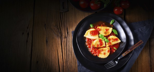 Ravioli alla genovese with basil and tomato sauce